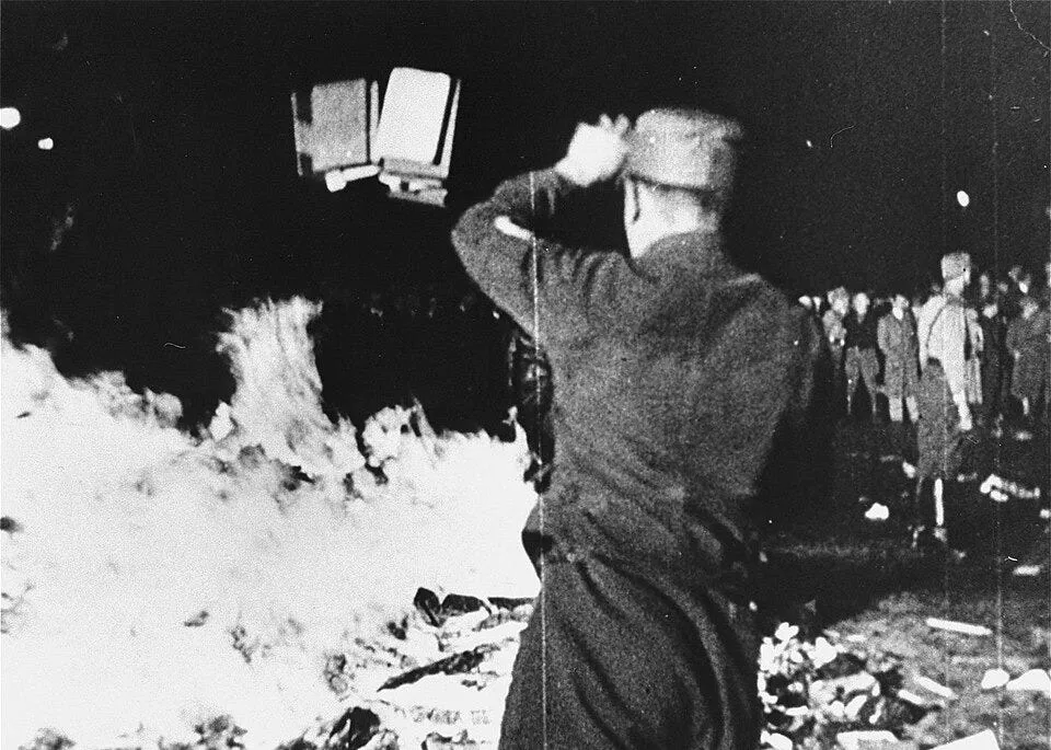 black and white photograph of a crowd around a bonfire of books in berlin, 1933
